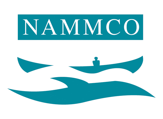 The logo with NAMMCO on top and on the bottom a shape which looks like a whale and a boat with a human.